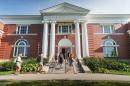 students walking into academic building